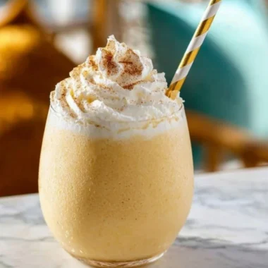 Delicious eggnog milkshake topped with whipped cream and nutmeg