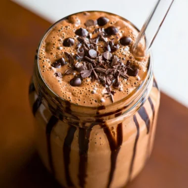 Chocolate protein shake with a rich, creamy texture in a glass