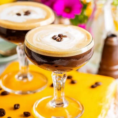 Delicious Espresso Martini cocktail served in a stylish glass with coffee beans garnish.