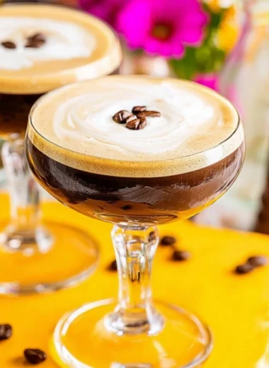 Delicious Espresso Martini cocktail served in a stylish glass with coffee beans garnish.