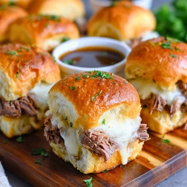 Delicious French Dip Sliders served with a savory dipping sauce.