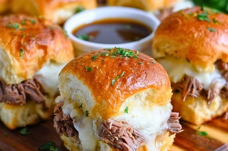 Delicious French Dip Sliders served with a savory dipping sauce.