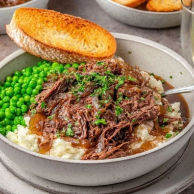Delicious French Onion Pot Roast served with caramelized onions and herbs
