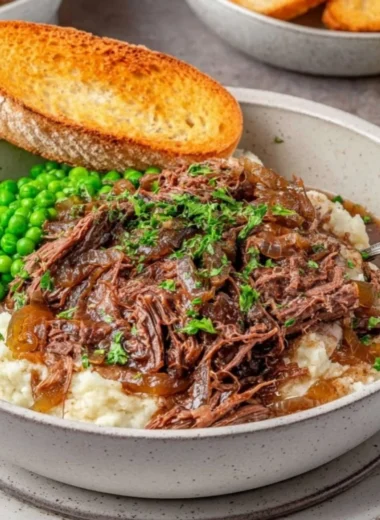 Delicious French Onion Pot Roast served with caramelized onions and herbs