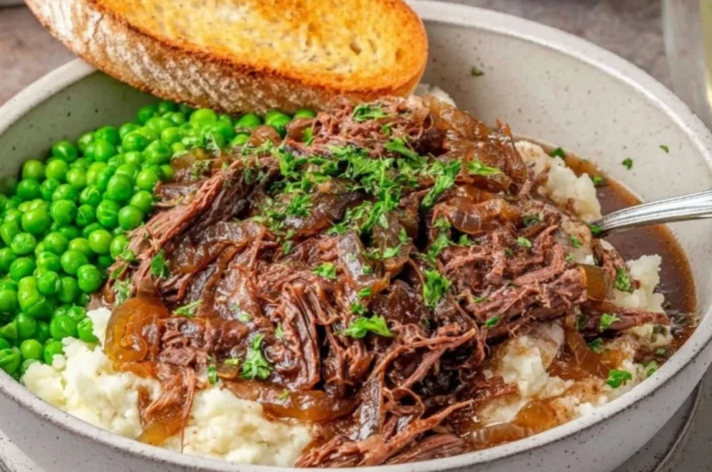 Delicious French Onion Pot Roast served with caramelized onions and herbs