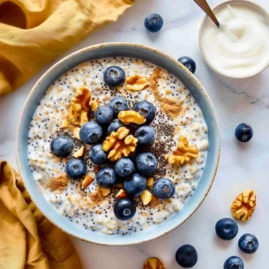 High protein blueberry overnight oats topped with yogurt and fresh blueberries