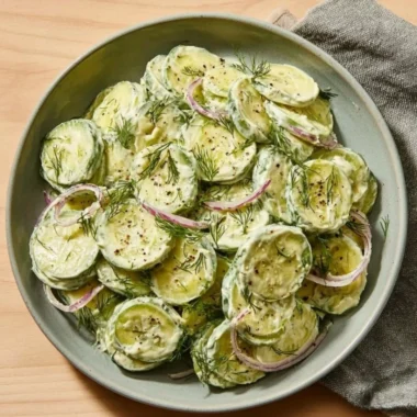 High-protein cucumber salad with colorful vegetables and dressing