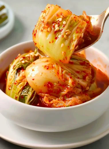 A variety of kimchi in different dishes, showcasing its vibrant colors and flavors.
