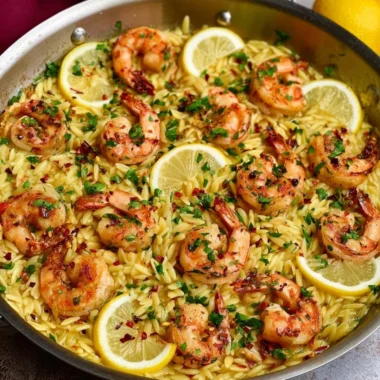 Delicious Lemon Garlic Shrimp Orzo served in a bowl with fresh herbs