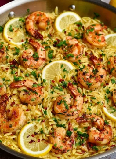 Delicious Lemon Garlic Shrimp Orzo served in a bowl with fresh herbs