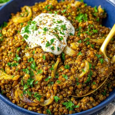 Mediterranean lentils and quinoa skillet topped with caramelized onions.