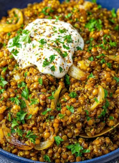 Mediterranean lentils and quinoa skillet topped with caramelized onions.