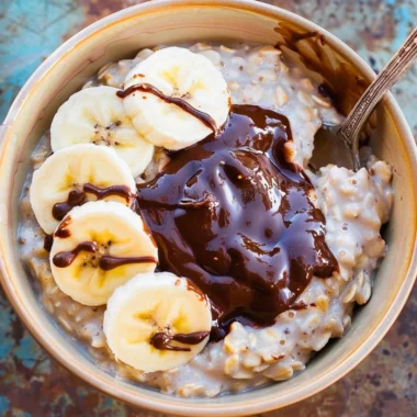 Healthy oatmeal smoothie with fruits and oats in a glass
