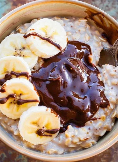 Healthy oatmeal smoothie with fruits and oats in a glass