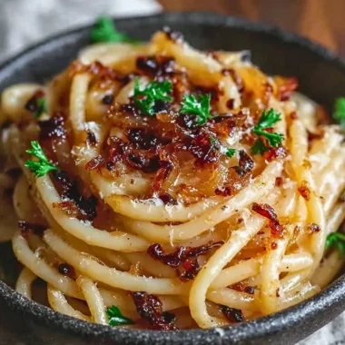 Delicious pasta dish topped with caramelized onions for a savory flavor.