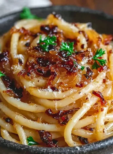 Delicious pasta dish topped with caramelized onions for a savory flavor.