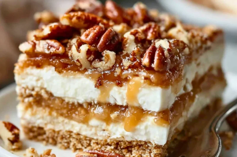 Pecan pie lasagna with layers of creamy filling and crunchy pecans