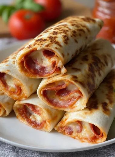 A delicious pizza burrito filled with cheese, sauce, and fresh toppings.