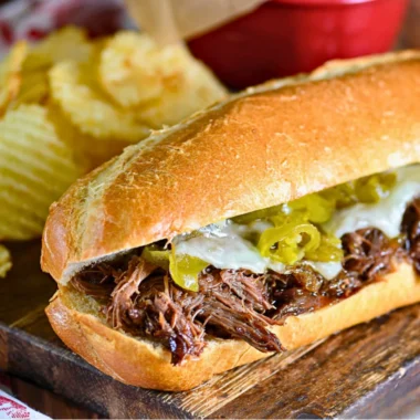 Slow Cooker Italian Beef Sandwiches served with condiments