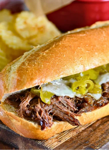 Slow Cooker Italian Beef Sandwiches served with condiments