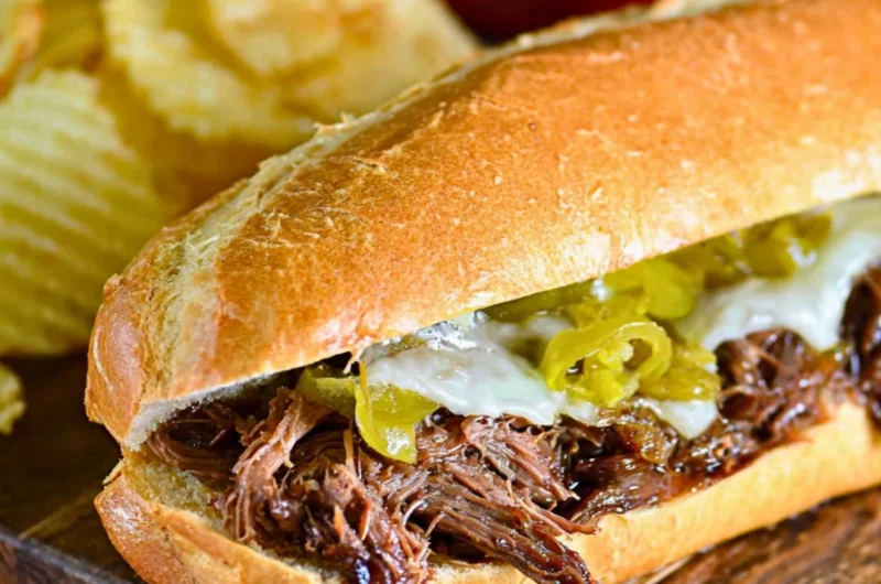 Slow Cooker Italian Beef Sandwiches served with condiments