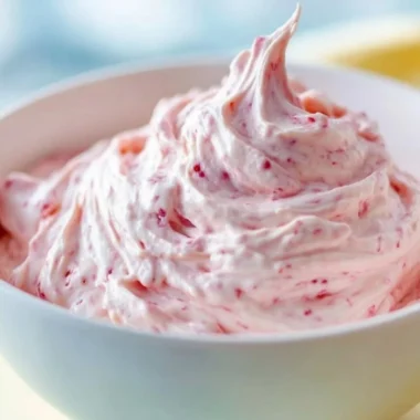 Strawberry marshmallow frosting beautifully decorated on a cupcake