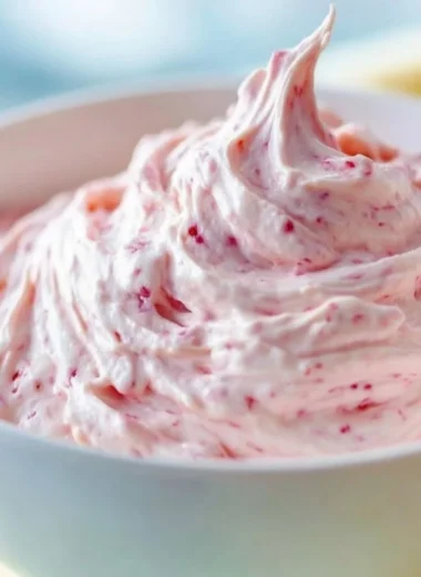 Strawberry marshmallow frosting beautifully decorated on a cupcake