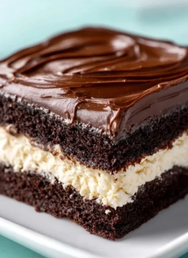 Delicious slice of amazing Ding Dong Cake with chocolate and cream filling