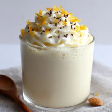 Delicious white chocolate orange almond cocoa drink topped with almond slivers.