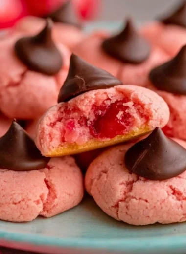 Christmas Cherry Blossom Cookies arranged on a festive plate.