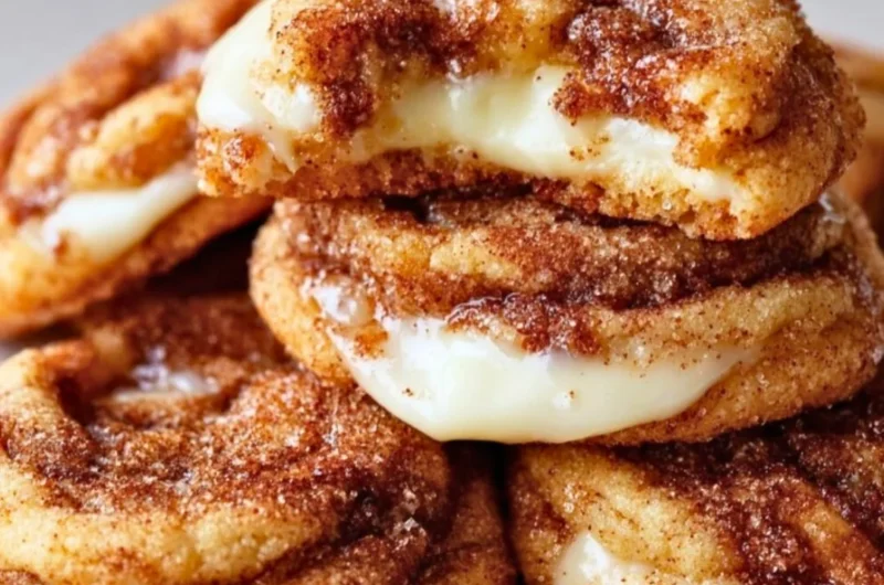 Delicious Cinnamon Roll Cheesecake Cookies on a plate, drizzled with icing