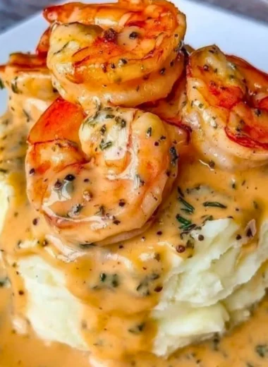 Plate of creamy garlic shrimp served over fluffy mashed potatoes