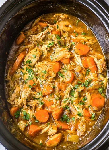 Crockpot chicken thigh pot roast served with vegetables
