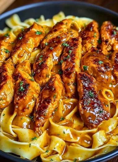 Delicious homemade butter chicken served with rice and naan
