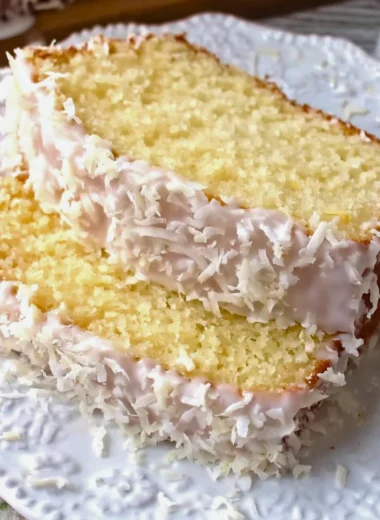 Homemade coconut pound cake with a moist texture and coconut flakes