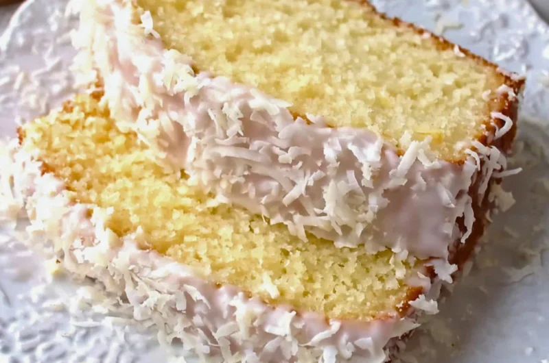 Homemade coconut pound cake with a moist texture and coconut flakes