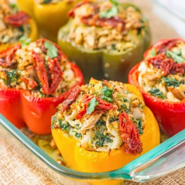 Plate of Mediterranean Chicken stuffed bell peppers, garnished and ready to serve.