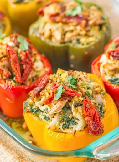 Plate of Mediterranean Chicken stuffed bell peppers, garnished and ready to serve.
