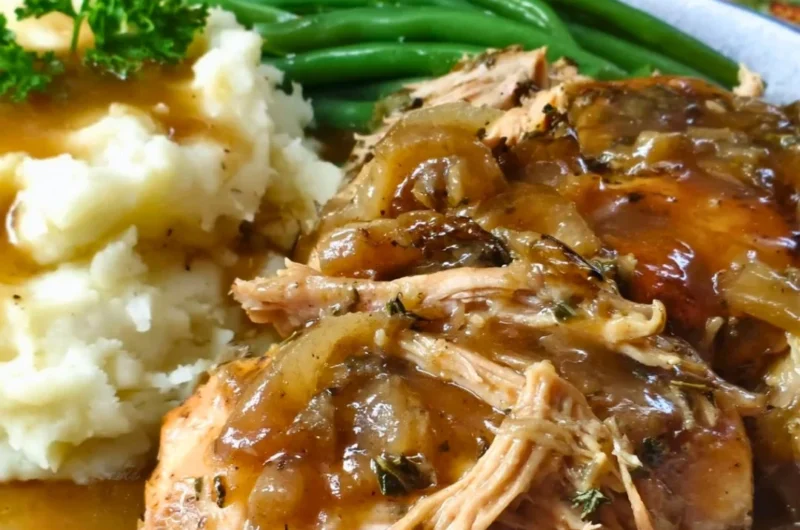 Juicy Mississippi Chicken served with spicy sauce and garnished with herbs
