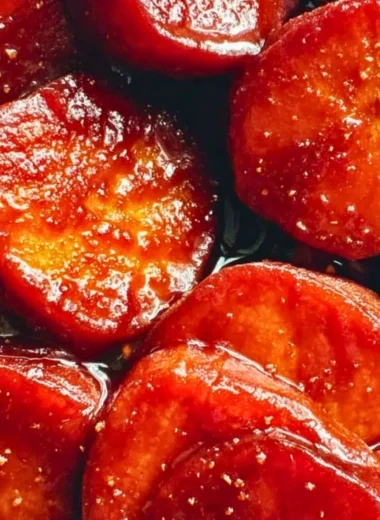 Oven baked candied yams drizzled with caramel sauce, ready to serve