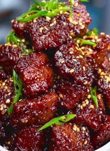 Sweet and sticky steak bites recipe served as an appetizer.