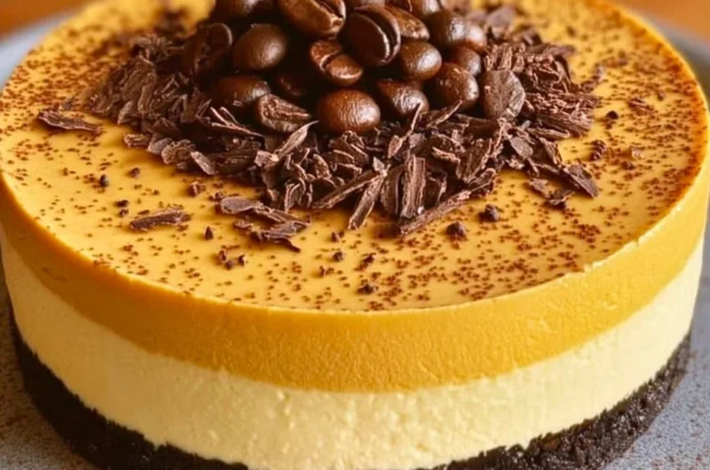 Ultimate Coffee Lover's Cheesecake topped with coffee beans and chocolate shavings