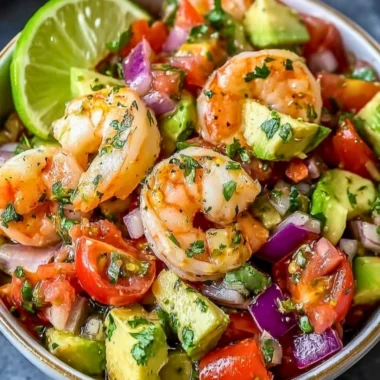 Zesty Lime Shrimp and Avocado Salad garnished with lime slices