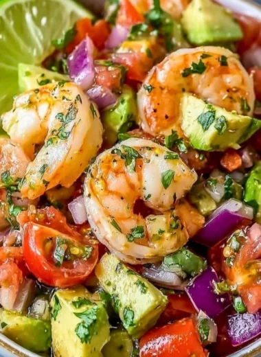 Zesty Lime Shrimp and Avocado Salad garnished with lime slices