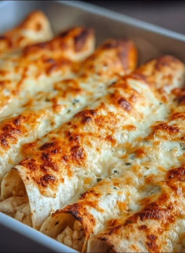 Delicious protein-rich chicken enchiladas with creamy white sauce