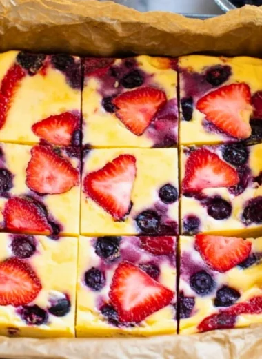Homemade baked yogurt served in a stylish dish with fresh berries.