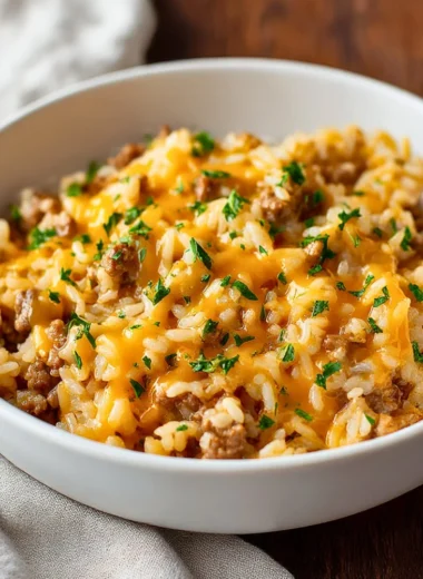 Cheesy beef rice casserole with ground beef, rice, and melted cheese