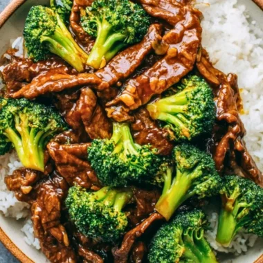 Stir-fried Chinese Beef and Broccoli with vibrant greens and tender beef slices.