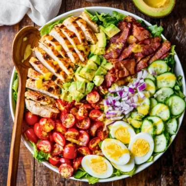 Delicious Grilled Chicken Cobb Salad with fresh vegetables and dressing