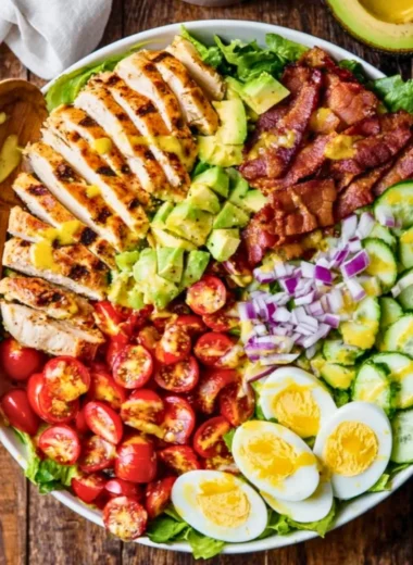 Delicious Grilled Chicken Cobb Salad with fresh vegetables and dressing